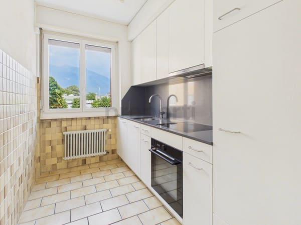 Immobilie in Bellinzona - Elegante appartamento rinnovato con balcone - Bild 3
