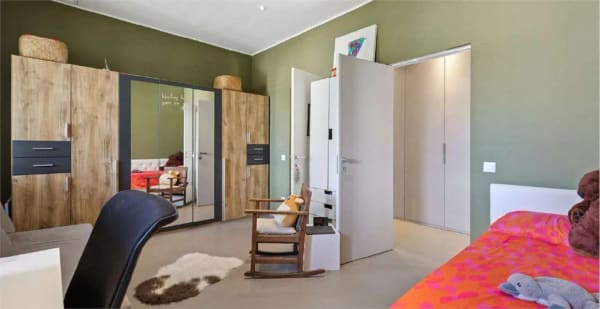 Immobilie in Porza - elegante appartamento 3,5 locali con ampio giardino - Bild 10