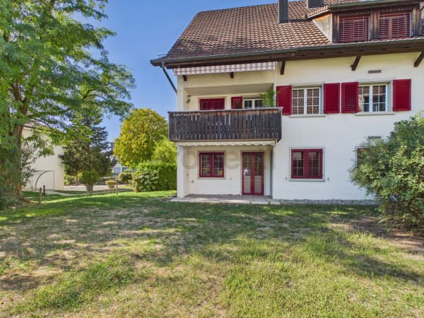 Immobilie in Oberglatt Zh - Gemütliche 3.5-Zimmer-Gartenwohnung mit Kamin und Gestaltungspotenzial - Bild 0