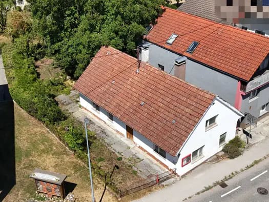 Immobilie in Neuhofen an der Krems - Mehrfamilienhaus zum Kauf - Neuhofen an der Krems - 435.000 € - 8 Zimmer, 180 m², 671 m² Grundstück, frei ab 01.10.2026 - Bild 0