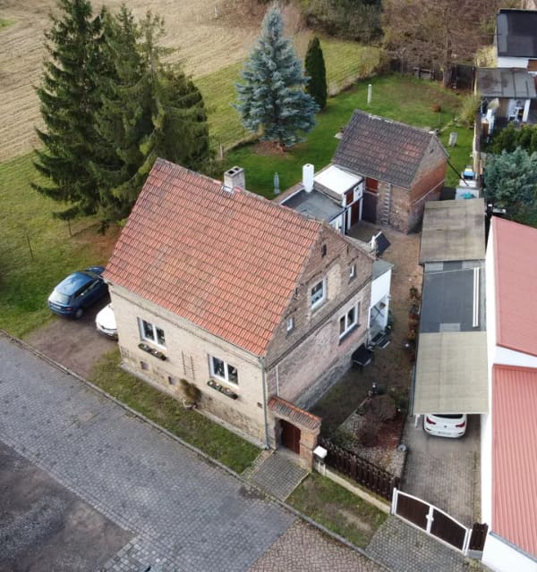 Immobilie in Seegebiet Mansfelder Land - Charmantes Einfamilienhaus mit Carport, Garage & Nebengelass - Bild 2
