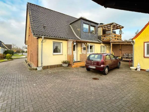 Immobilie in Timmaspe - Gut vermietete Doppelhaushälfte in begehrter Sackgassenlage von Timmaspe - Bild 1