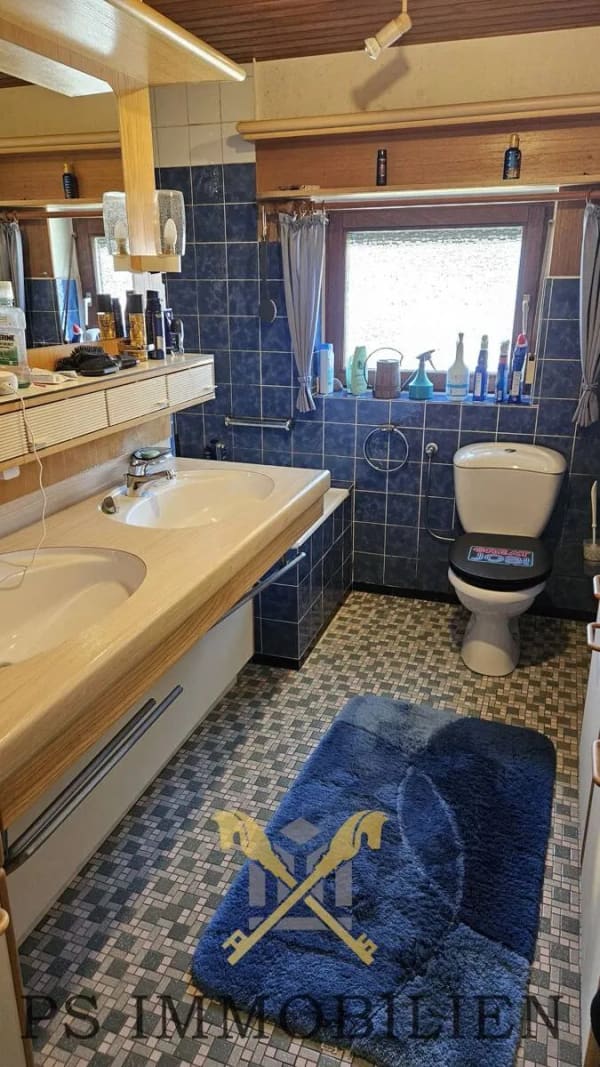 Immobilie in Gönnebek - Gemütliches Wohnhaus mit großzügiger Gewerbeeinheit und Baugrundstück wartet auf Ihre Ideen - Bild 1