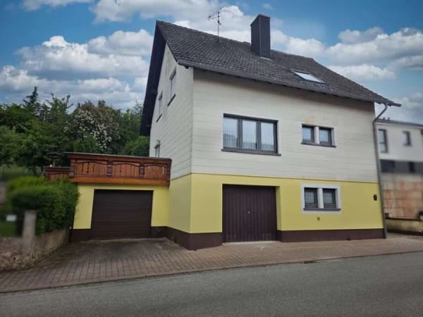 Immobilie in Dunzweiler - 1-Familienhaus mit Ausbaupotenzial: Garten, Südterrasse, 2 Garagen & optionale 2. Wohneinheit - Bild 2