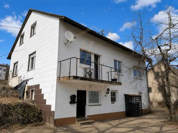 Immobilie in Münsingen - Charmantes Einfamilienhaus mit viel Potenzial für Ihre Wohnträume - Bild 1