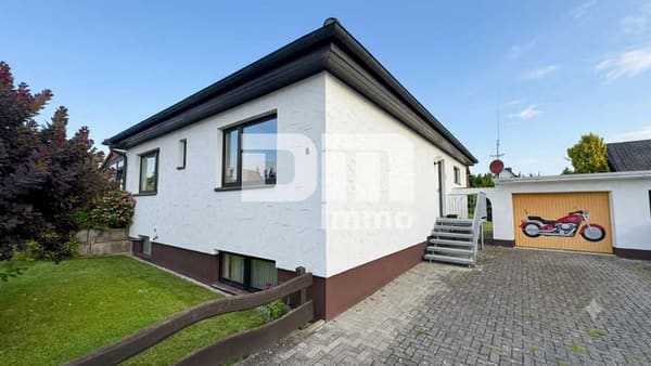 Immobilie in Calden - Solider Familien-Bungalow mit großem Potenzial in ruhiger Lage mit Wintergarten und Garage - Bild 0