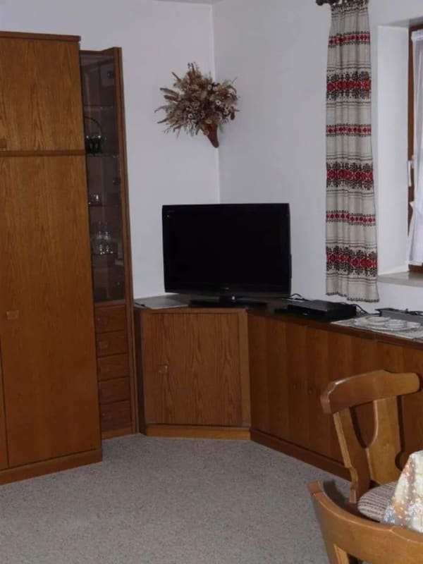 Immobilie in Unterwössen - Außergewöhnliche, ruhige 2-Zimmer-Wohnung mit großem Ost-/West-/Südbalkon, EBK, Einzelgarage, Keller - Bild 1