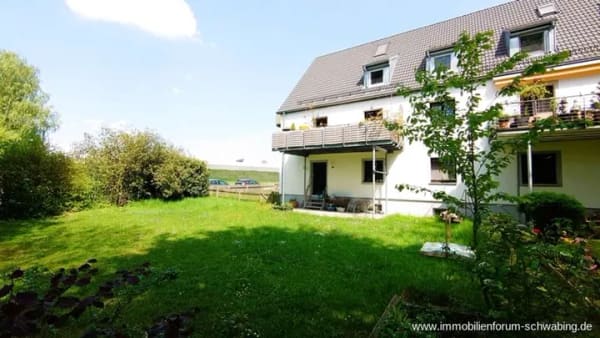 Immobilie in Unterföhring - 3-Zimmer-Wohnung mit Sonnenterrasse, 400 m² Gartenanteil und beheizten Hobby-Raum in Unterföhring! - Bild 1