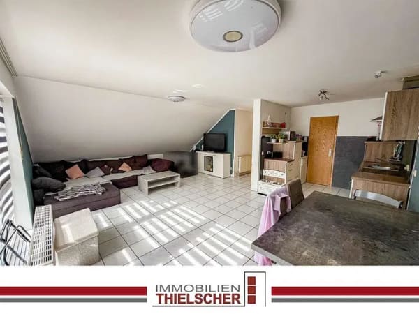 Immobilie in Übach-Palenberg - 3-Zimmer-Wohnung im Dachgeschoss mit Balkon, Blick ins Grüne und Außenstellplatz zentral in Boscheln - Bild 0