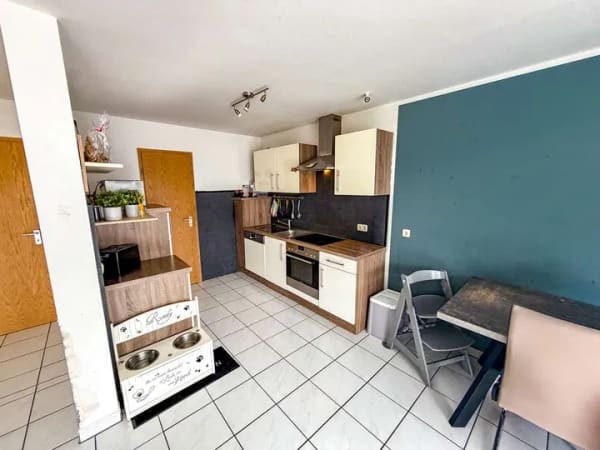 Immobilie in Übach-Palenberg - 3-Zimmer-Wohnung im Dachgeschoss mit Balkon, Blick ins Grüne und Außenstellplatz zentral in Boscheln - Bild 2