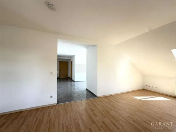 Immobilie in Kolbermoor - Wohnen im historischen Tonwerk - großzügige 4 Zimmer-Dachgeschoss-Wohnung mit Bergblick - Bild 1