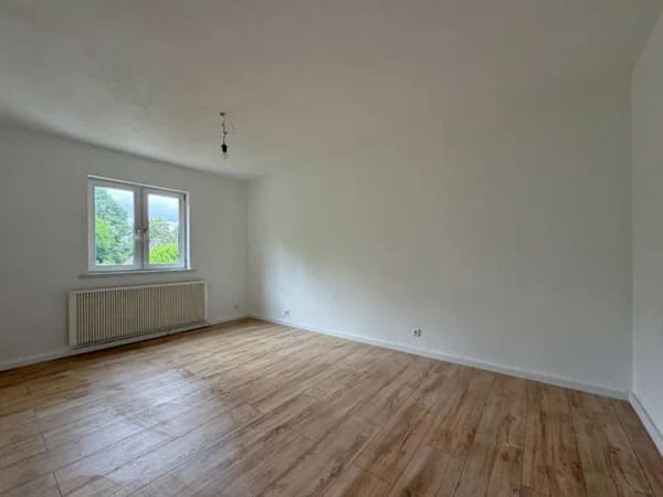 Immobilie in Efringen-Kirchen - Kaufen statt mieten, renovierte 3-Zi.-Wohnung mit Kaminofen, neuem Bad und Gartennutzung - Bild 2