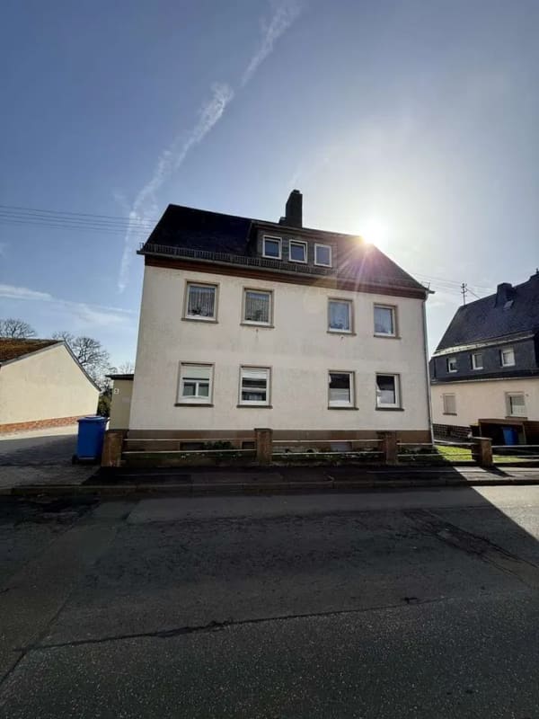 Immobilie in Emmelshausen - Vermietetes Mehrfamilienhaus mit Terrasse und Garagen in Emmelshausen - Bild 1