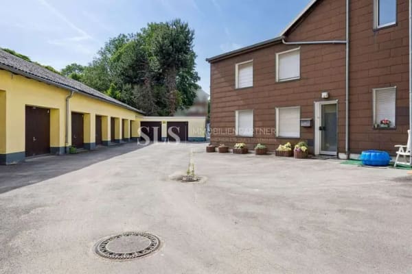 Immobilie in Witten - Mehrfamilienhaus mit sieben Wohneinheiten, neun Garagen und zusätzlichem Mietsteigerungspotenzial - Bild 1