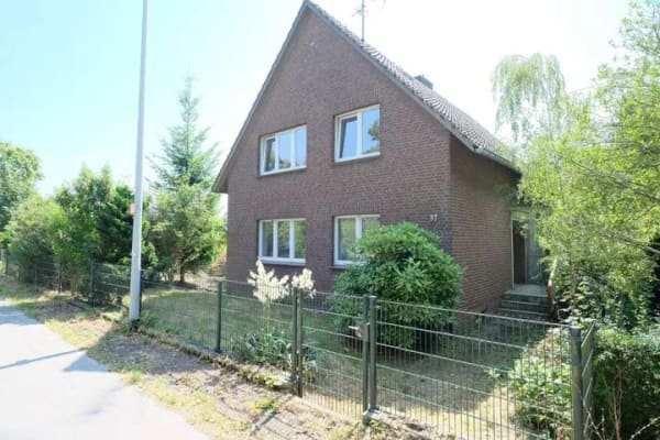 Immobilie in Kranenburg - Charmantes Zweifamilienhaus mit Garten, Garage und freiem Feldblick - Bild 1