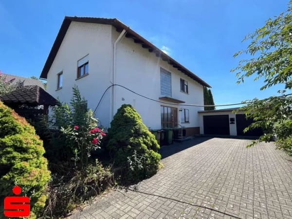 Immobilie in Schöntal - Gepflegtes Zweifamilienhaus mit großem Garten, zwei Garagen und viel Potenzial in Marlach - Bild 0