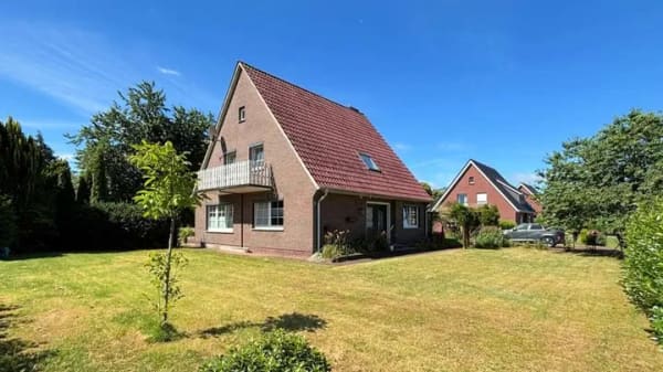 Immobilie in Barßel - Attraktives Einfamilienhaus mit Garage in begehrter Lage von Barßel-Harkebrügge - Bild 1