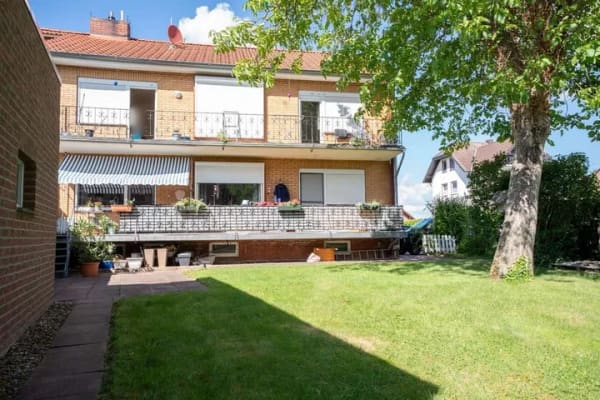 Immobilie in Heuerßen - Vermietete 3-Zimmer-Eigentumswohnung mit großem Balkon und Zugang zum Gemeinschaftsgarten - Bild 1