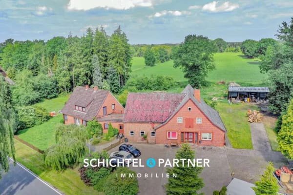 Immobilie in Vollersode - Giehlermoor | Zwei vermietete Einfamilienhäuser und ein Baugrundstück - Bild 0