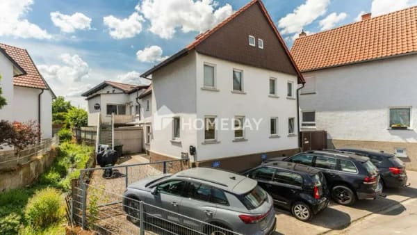 Immobilie in Langgöns - Solide Basis für Ihre Wohnträume: Weitläufiges Haus in attraktiver Ortsmitte - Bild 1