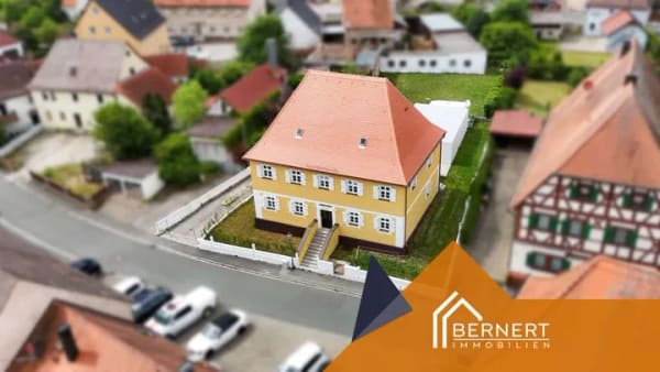 Immobilie in Aurachtal - Historischer Charme trifft modernen Wohnkomfort – Exklusive 3-Zimmer-Eigentumswohnung im Erstbezug - Bild 1