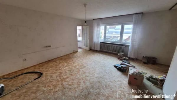 Immobilie in Hockenheim - Sanierungsbedürftiges 3-Familienhaus mit vermietetem Gewerbe - Bild 1