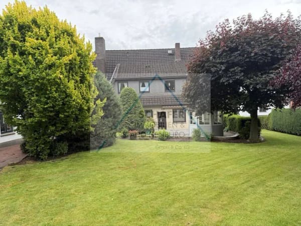 Immobilie in Bassum - Zweifamilienhaus mit Gewerbefläche zu verkaufen - Bild 0