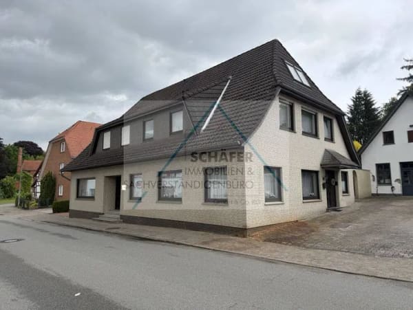 Immobilie in Bassum - Zweifamilienhaus mit Gewerbefläche zu verkaufen - Bild 2