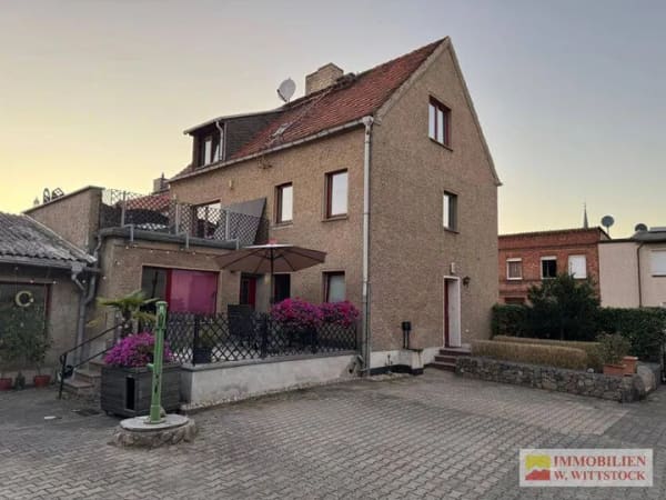 Immobilie in Putlitz - Haus mit Einliegerwohnung mit Großgarage und Garten in Putlitz - Bild 0