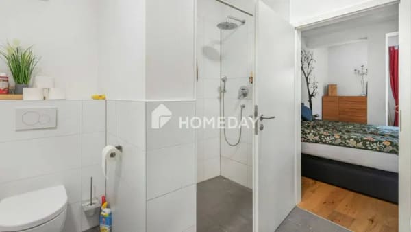 Immobilie in Edingen-Neckarhausen - Vermietete Erdgeschosswohnung mit überdachter Terrasse und Garagenstellplatz - Bild 1