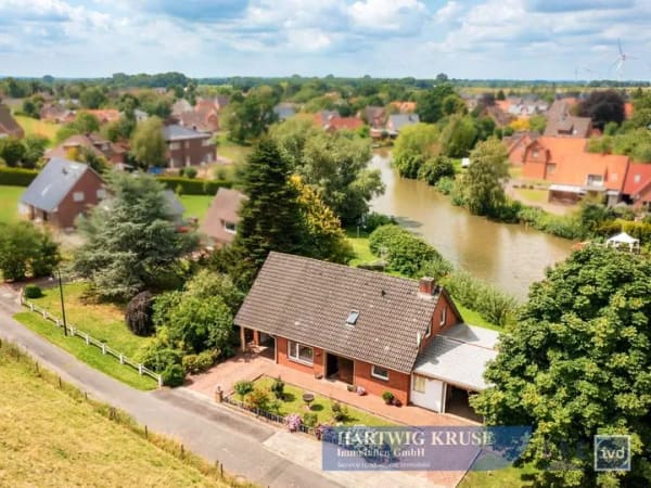 Immobilie in Wischhafen - Wohnen am Wasser ? gepflegtes Einfamilienhaus mit Wintergarten und großzügigem Ufergrundstück - Bild 1