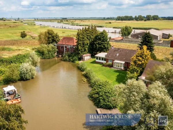Immobilie in Wischhafen - Wohnen am Wasser ? gepflegtes Einfamilienhaus mit Wintergarten und großzügigem Ufergrundstück - Bild 2
