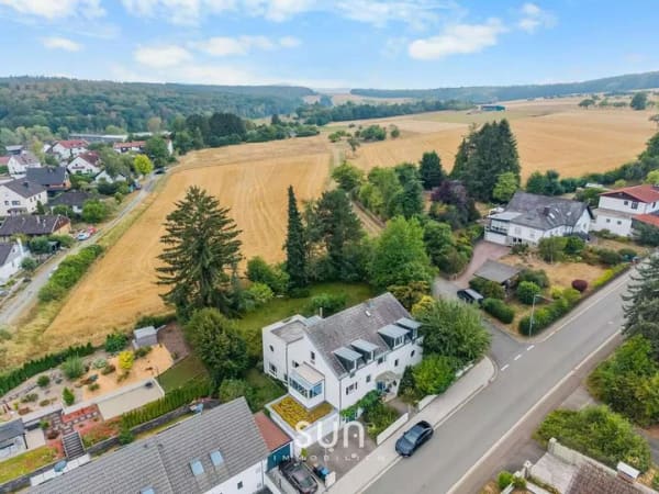 Immobilie in Wehrheim - TRAUMHAFTES ARCHITEKTENHAUS IN ERSTER FELDRANDLAGE – 409 m² Wohnen & Arbeiten im Grünen - Bild 0