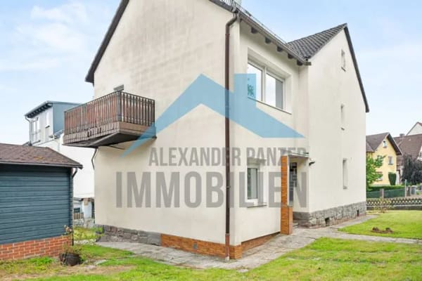 Immobilie in Ahnatal - Renovierungsbedürftiges Zweifamilien mit Keller und Garage in ruhiger Wohnlage von Ahnatal-Weimar! - Bild 1