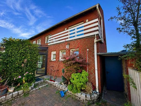Immobilie in Greven - Vielseitige Doppelhaushälfte in Greven mit Wintergarten, Balkon und Garten - Bild 1