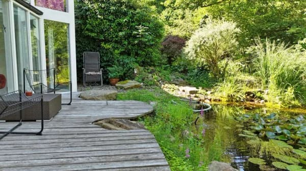 Immobilie in Utting am Ammersee - Stilvoll renovierte 3-Zimmer-Wohnung mit Traumgarten, Wintergarten, Naturteich & Doppelcarport - Bild 4