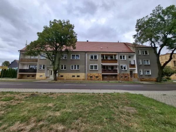 Immobilie in Aschersleben - 4-Raum-Eigentumswohnung mit Balkon, Gartenanteil, 2 Kellerräumen und Garage  in Schackenthal - Bild 2