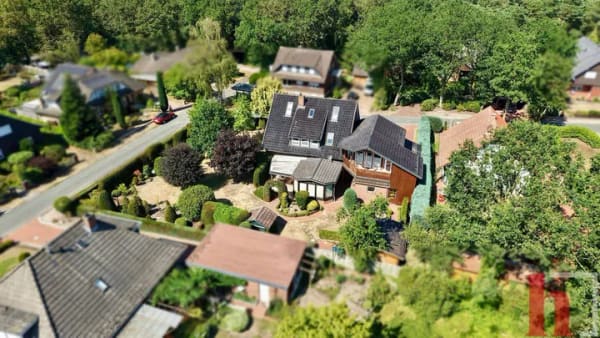 Immobilie in Neuenkirchen-Vörden - Großzügiges Zweifamilienhaus mit Wintergarten, Sauna & charmantem Garten - Bild 1