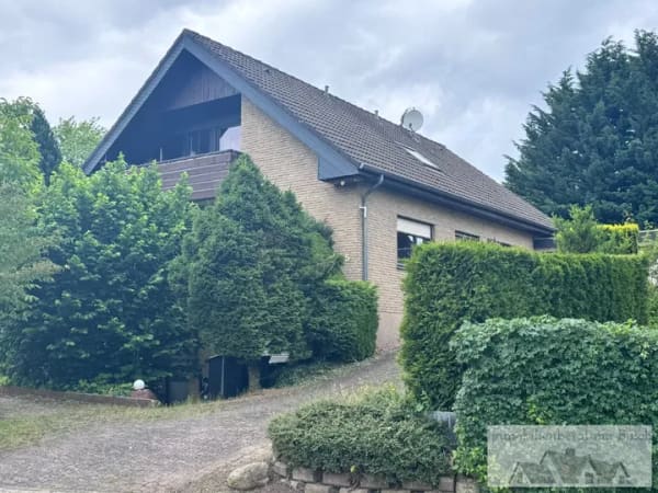 Immobilie in Schlangen - Energieeffizientes Einfamilienhaus mit Einliegerwohnung – barrierefrei und rollstuhlgerecht im EG - Bild 1