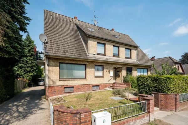 Immobilie in Schenefeld - Mehrfamilienhaus mit 4 vermieteten Wohnungen, 4 Garagen und großzügigem Gartengrundstück - Bild 0