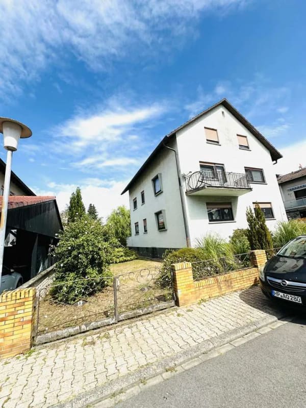 Immobilie in Lampertheim - Teilrenoviertes Dreifamilienhaus in ruhiger Lage von Hüttenfeld - Bild 1