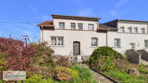 Immobilie in Mettlach - SOFORT VERFÜGBAR:
WOHNHAUS IN ORSCHOLZ MIT 3 SCHLAFZIMMERN UND WINTERGARTEN SOWIE GARTEN - Bild 1