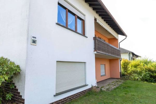 Immobilie in Holzappel - Freistehendes Einfamilienhaus mit Balkon und Garage, Hanglage-Terrasse & großem Garten! - Bild 3