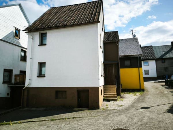Immobilie in Mengerskirchen - Neuer Preis!! Kleines Einfamilienhaus im Ortskern von Mengerskirchen - Bild 1