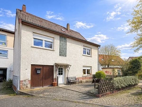 Immobilie in Stadecken-Elsheim - Ortsrandlage von Stadecken-Elsheim: Charmantes Einfamilienhaus mit Terrasse, Garten und Fernblick - Bild 1
