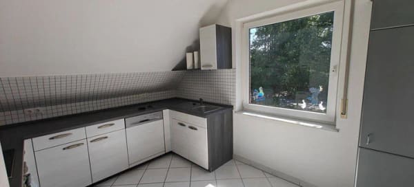 Immobilie in Ganderkesee - Dachgeschosswohnung in Zweifamilien-Haus mit Gartenanteil und Garage - Bild 1