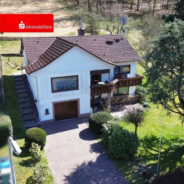 Immobilie in Flörsbachtal - Einfamilienhaus mit großem Grundstück und Garage in Flörsbach - Bild 0