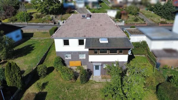 Immobilie in Reiskirchen - Familienfreundliches Einfamilienhaus mit großem Grundstück und viel Potenzial - Bild 2