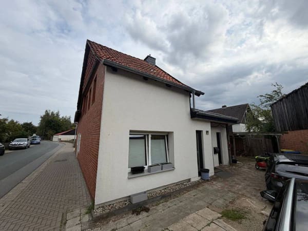 Immobilie in Harsum - Gepflegtes Einfamilienhaus mit Teilneubau, Solarthermie und Carport in Hönnersum - Bild 1