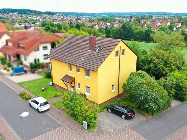 Immobilie in Neuhof - Großzügiges Wohnhaus mit drei Wohneinheiten und zusätzlichem Baugrundstück - Bild 2